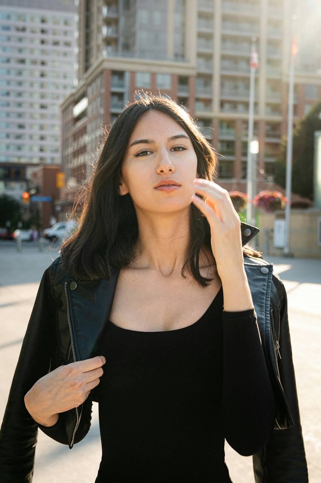 Portrait of a professional woman with dark hair in a blazer