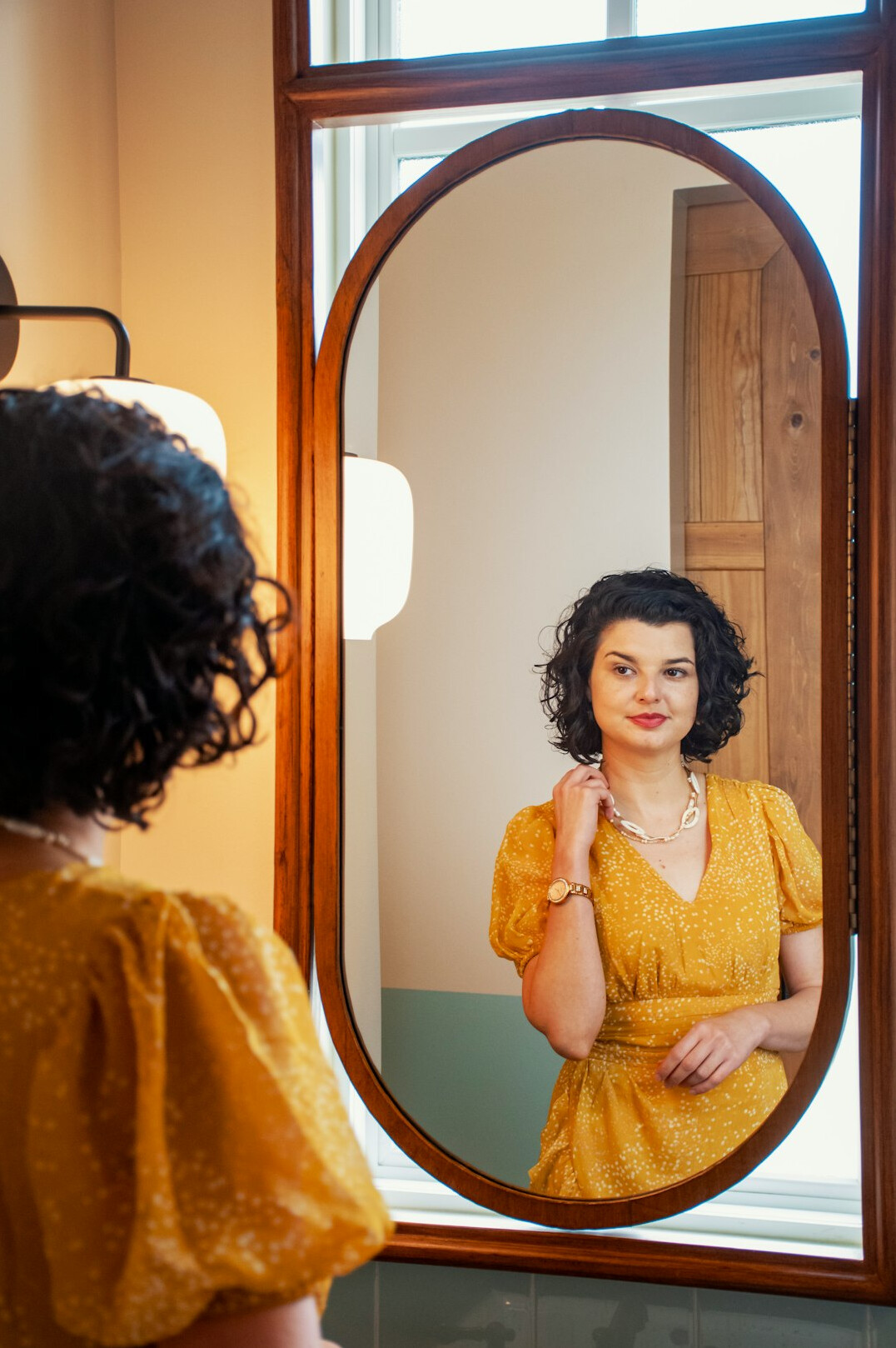 woman practicing speech in mirror