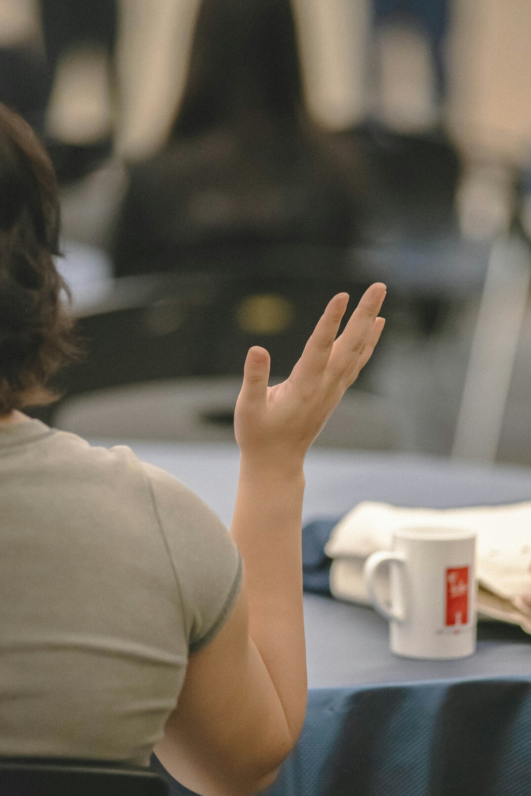 person speaking confidently at meeting